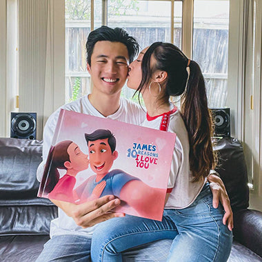 A girl and her dad showing the Anastasia Becomes a Big Sister book with ultrasound photos